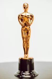 Close-up of a golden star trophy on a dark base, symbolizing achievement and excellence.