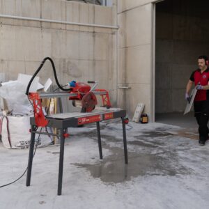 Manual tile cutter in use